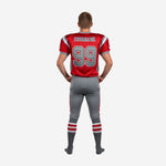Back view of custom red youth football uniforms showing back number placement, nameplate area, and grey pant construction with red side stripe