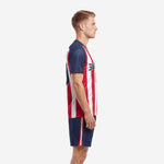 Side view of sublimated red white and navy soccer uniform for teams showing raglan sleeve detail