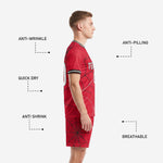 Red sublimated soccer shorts with black spiderweb graphic, matching custom team kit shorts detail