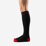 Right side profile of custom red and black soccer socks displaying jet black knit body and red contrast toe