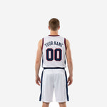 Opposite side view of custom red white blue basketball uniform highlighting double navy and red binding at armhole and navy shorts side panel