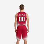 Front view of custom white reversible basketball jersey with red halftone dots rising from the hem and arched team name across the chest
