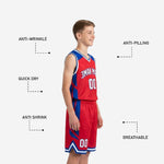 Back view of red youth basketball jersey and shorts with royal blue side panels and space for back player name and number personalization