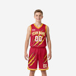 Custom red youth basketball uniforms with gold claw-slash sublimated design, crimson jersey and shorts set shown from the front