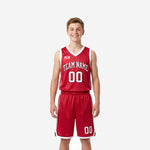 Red youth basketball uniforms - youth boy wearing red and white sublimated V-neck jersey and matching shorts with white side stripes, front view