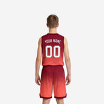 Back view of red youth basketball uniforms showing back number placement and gradient print on jersey and shorts