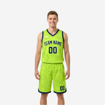 Lime green reversible basketball jersey and shorts with navy topographic contour pattern and navy V-neck binding, front view on male model