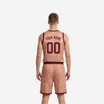 Side view of the blush reversible basketball jersey and matching shorts showing maroon waistband and contour line pattern