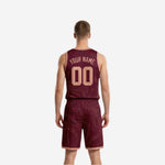 Side view of the maroon reversible basketball jersey showing armhole binding and flowing contour pattern across the torso
