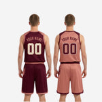 Close-up of the full-dye sublimation brush-stroke print on the maroon and dusty-rose reversible basketball uniform, showing color depth and print clarity