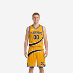 Gold side of the custom reversible club basketball uniform showing navy diagonal swoosh stripe, team name in navy lettering, and number 00 on shorts