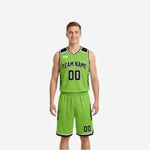 Lime green side of the reversible basketball uniform set showing black team name, black number, and matching lime green shorts with black slash accents