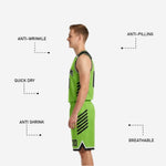 Close-up detail of the black and lime green reversible basketball shorts showing white hem binding and lime green number print on the front