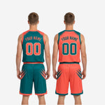 Full set view of custom reversible basketball uniform in teal and orange including jersey and matching shorts laid flat