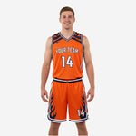 Reversible basketball uniform in orange and navy blue with flame graphics, front view