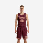 Reversible basketball uniforms with names and numbers in maroon with blush topographic contour pattern, arched team name and front number on both sides