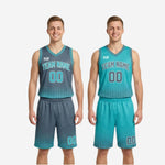 Detail shot of halftone dot fade sublimation pattern on charcoal and teal reversible basketball uniform jersey hem zone