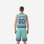 Side view of custom reversible basketball uniforms in purple showing hex dot fade pattern on jersey side panel and shorts leg