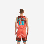 Side view of reversible team basketball uniforms showing teal armhole binding and lightning print on jersey and shorts