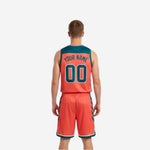 Orange reverse side of reversible tournament basketball uniform with teal side panels and cream hem band, side view