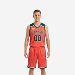 Custom reversible basketball uniform set showing the teal side and the orange reverse side, full sublimation print with matching shorts