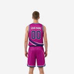 Magenta side view of reversible travel basketball uniforms with purple and white swoosh stripe and matching shorts on male model