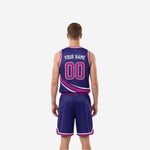 Side view of custom purple and magenta reversible basketball uniform showing armhole binding and side panel construction