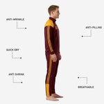 Detail view of maroon soccer track pants with dual Athletic Gold side stripes and gold ankle trim panel
