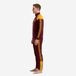Right side view of custom red and gold soccer tracksuit set with tapered pant cut and gold ankle trim