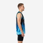 Front view of custom royal blue basketball jersey with black body, rising blue flame graphic, cyan V-neck binding and arced team name