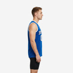 Front view of royal blue and white custom basketball jersey showing arced team name and sublimated number on solid blue body