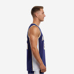 Front view of custom sublimated basketball jersey in navy with gold trim neckline binding and white arched team name on chest