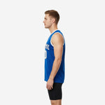 Side view of custom royal blue basketball jersey showing straight hem, tuck-in length, and white armhole binding on adult male model