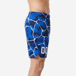 Side view of royal blue basketball shorts showing camo crack sublimation print, elastic waistband with drawcord, and side split hem