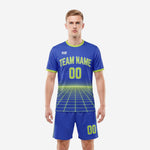 Front view of a Royal Blue and Neon Green custom blue soccer uniform with grid pattern jersey and matching shorts worn by a male model