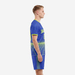 Left side view of a Royal Blue Neon Green custom blue soccer uniform showing the grid print running from jersey hem to shorts side panel