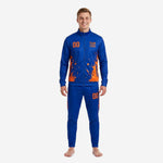 Men's royal blue soccer tracksuit with orange splash sublimation print - front view of full 2-piece set with team logo and number