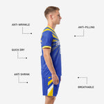 Outer thigh detail of royal blue soccer shorts with angled gold and white chevron panel, matching kit design