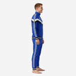 Custom royal blue soccer tracksuit side view showing double white stripes on sleeve and pant leg with navy ribbed ankle cuffs