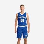 Custom royal blue and white reversible basketball uniforms front view showing topographic contour pattern on blue side with white team name and number