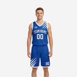 Royal blue and white reversible basketball uniforms front view showing blue side with diagonal white brush-stroke panels and arched team name