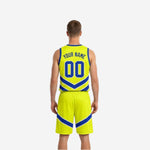 Reversible basketball uniform for teams side view showing yellow-green body with royal blue chevron detailing and matching shorts
