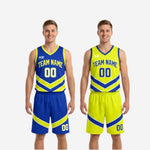 Matching shorts detail showing elastic waistband, drawcord, and chevron leg panel on the royal blue reversible basketball uniform set
