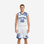 White side of custom royal blue and white reversible basketball uniforms with blue brush-stroke shoulder panels and blue V-neck binding on male model