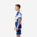 Royal Blue and white sublimated soccer uniform side view with crew neck trim and matching shorts