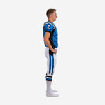 Custom royal blue youth football uniform with V-neck collar, white and black shoulder stripe, number 3 on chest and sleeve, white pants with blue black side stripe - front close-up