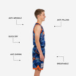Left side view of royal blue camo youth basketball uniform set with orange crackle overlay and V-notch hem trim on shorts