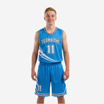 Royal blue youth basketball uniforms full set front and back view showing curved white stripe accents and navy binding on jersey and matching shorts