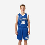 Royal blue youth basketball uniforms full set showing V-neck jersey with arced team name and number 00 plus matching shorts with white trim front and back