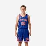 Royal blue youth basketball uniforms front and back full set with red dot-burst sublimated pattern on jersey and matching shorts in youth sizes